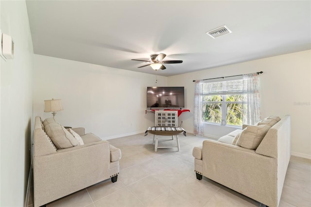 24748 Rio Villa Lakes Cir, Punta Gorda, FL 33950 - living room with a ceiling fan and light tile patterned floors