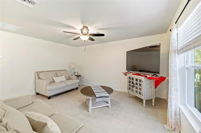 24748 Rio Villa Lakes Cir, Punta Gorda, FL 33950 - tiled living area featuring a ceiling fan and baseboards