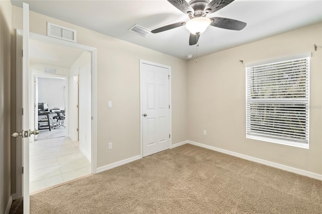 24748 Rio Villa Lakes Cir, Punta Gorda, FL 33950 - unfurnished bedroom with light colored carpet and ceiling fan