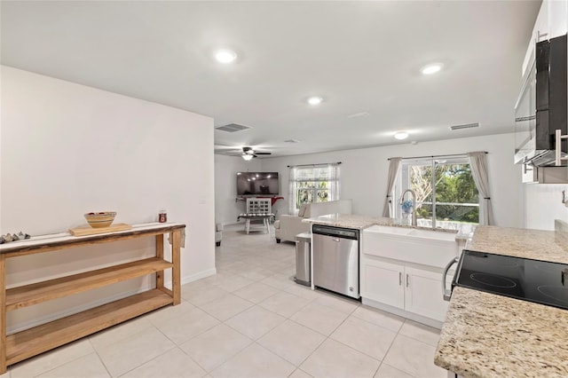 24748 Rio Villa Lakes Cir, Punta Gorda, FL 33950 - kitchen featuring stainless steel dishwasher, white cabinetry, ceiling fan, a peninsula, and open floor plan