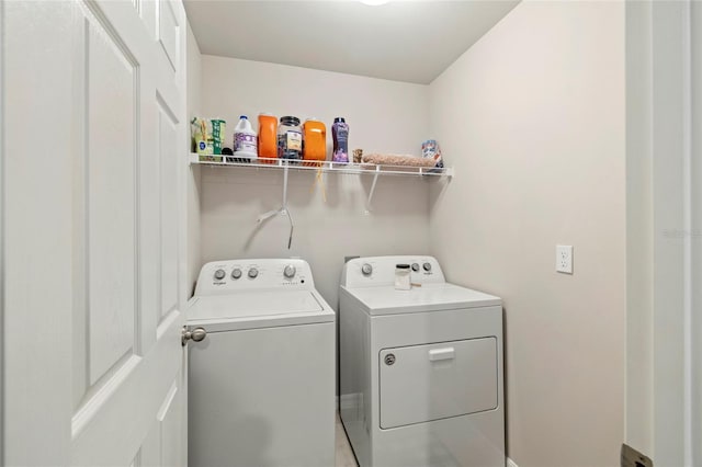 24748 Rio Villa Lakes Cir, Punta Gorda, FL 33950 - washroom featuring washing machine and clothes dryer