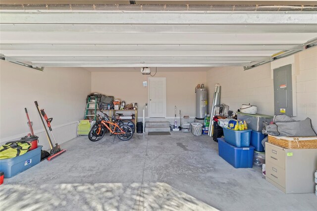 24748 Rio Villa Lakes Cir, Punta Gorda, FL 33950 - garage with electric water heater, a garage door opener, and electric panel