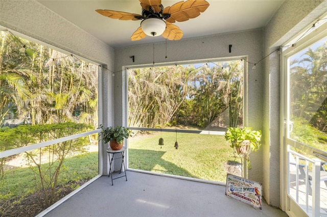 24748 Rio Villa Lakes Cir, Punta Gorda, FL 33950 - unfurnished sunroom with a ceiling fan and healthy amount of natural light