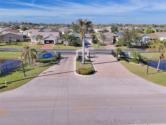 24748 Rio Villa Lakes Cir, Punta Gorda, FL 33950 - surrounding community featuring a residential view and decorative driveway