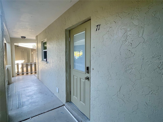 6300 Flotilla Dr Unit 71, Holmes Beach, FL 34217 - view of exterior entry with stucco siding