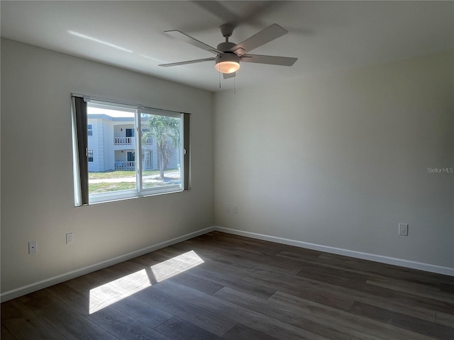 6300 Flotilla Dr Unit 71, Holmes Beach, FL 34217 - empty room featuring dark wood-type flooring and ceiling fan
