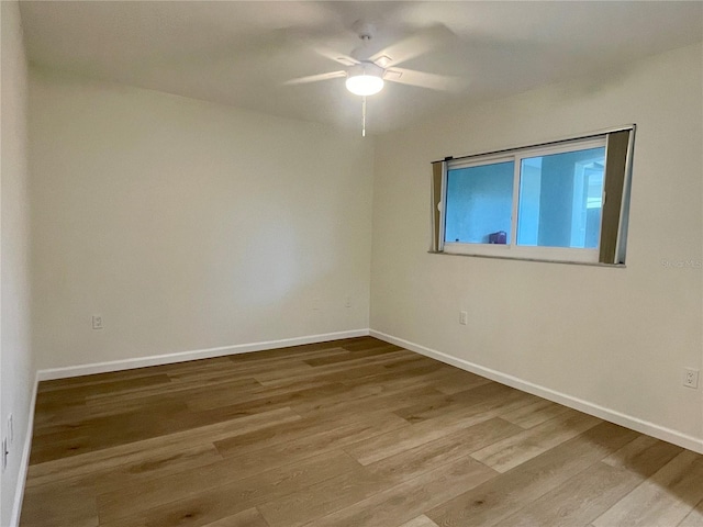 6300 Flotilla Dr Unit 71, Holmes Beach, FL 34217 - unfurnished room with wood finished floors and a ceiling fan