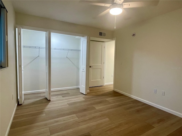 6300 Flotilla Dr Unit 71, Holmes Beach, FL 34217 - unfurnished bedroom featuring light wood-style flooring and ceiling fan