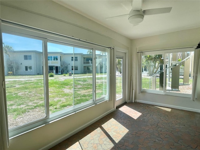 6300 Flotilla Dr Unit 71, Holmes Beach, FL 34217 - unfurnished sunroom with baseboards and stone finish floors