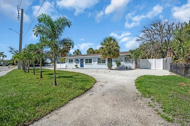 201 75th St Unit A, Holmes Beach, FL 34217 - ranch-style house featuring gravel driveway