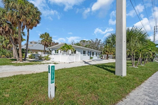 201 75th St Unit A, Holmes Beach, FL 34217 - view of front facade featuring a front lawn