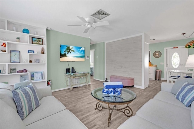 201 75th St Unit A, Holmes Beach, FL 34217 - living area featuring wood finished floors and ceiling fan