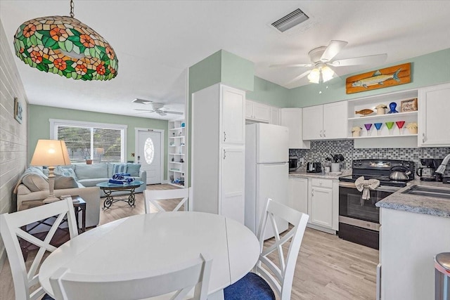201 75th St Unit A, Holmes Beach, FL 34217 - kitchen with freestanding refrigerator, electric range, ceiling fan, and open floor plan