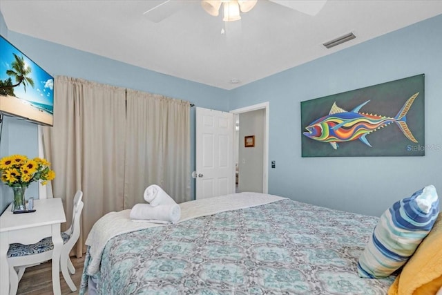 201 75th St Unit A, Holmes Beach, FL 34217 - bedroom with wood finished floors and ceiling fan