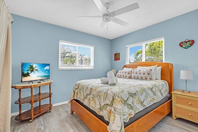 201 75th St Unit A, Holmes Beach, FL 34217 - bedroom featuring wood finished floors and a ceiling fan