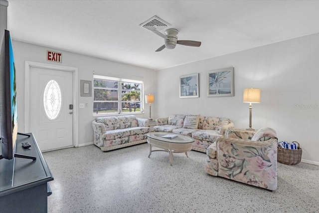 201 75th St Unit A, Holmes Beach, FL 34217 - living room with ceiling fan and speckle patterned floor