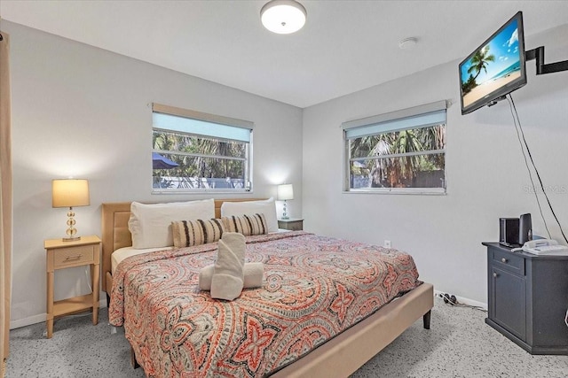201 75th St Unit A, Holmes Beach, FL 34217 - bedroom with speckle patterned floor and multiple windows