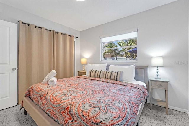 201 75th St Unit A, Holmes Beach, FL 34217 - bedroom featuring speckled floor and baseboards