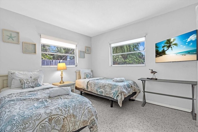 201 75th St Unit A, Holmes Beach, FL 34217 - bedroom featuring speckle patterned floor and baseboards