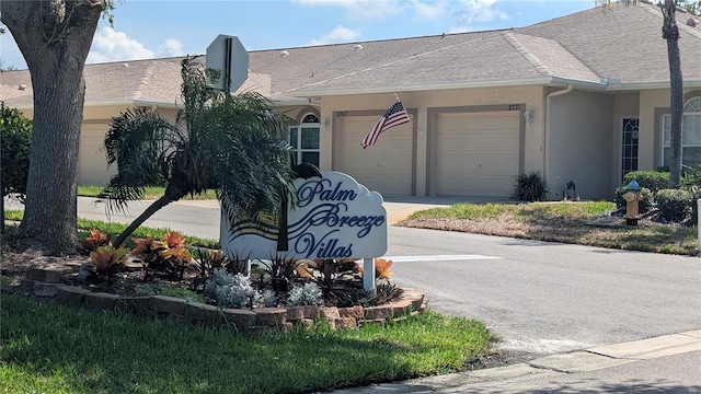 2641 73rd Ct W Unit 124, Bradenton, FL 34209 - community sign with an attached garage and concrete driveway