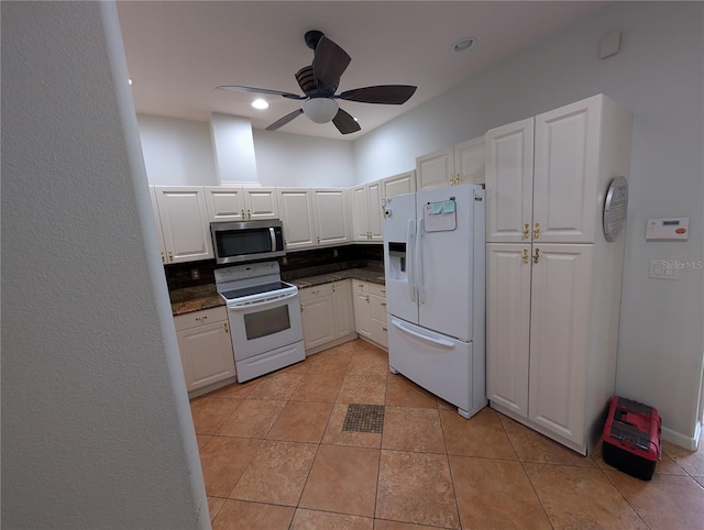 2641 73rd Ct W Unit 124, Bradenton, FL 34209 - kitchen featuring white appliances, dark countertops, white cabinetry, and a ceiling fan