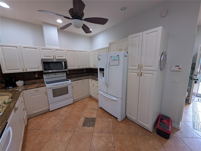 2641 73rd Ct W Unit 124, Bradenton, FL 34209 - kitchen featuring white appliances, white cabinets, a ceiling fan, recessed lighting, and light tile patterned floors
