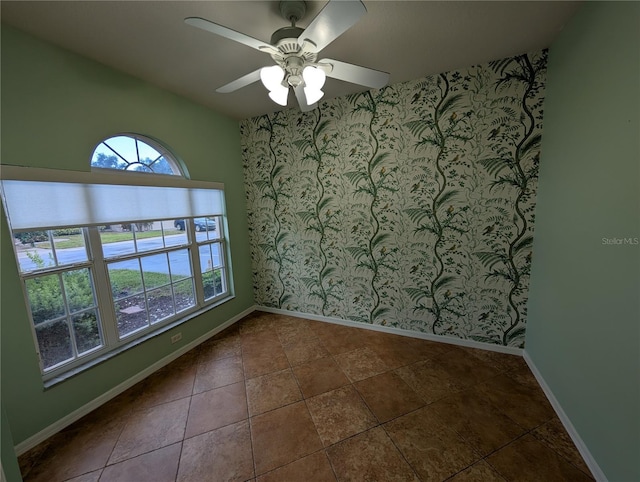 2641 73rd Ct W Unit 124, Bradenton, FL 34209 - empty room with a ceiling fan and wallpapered walls