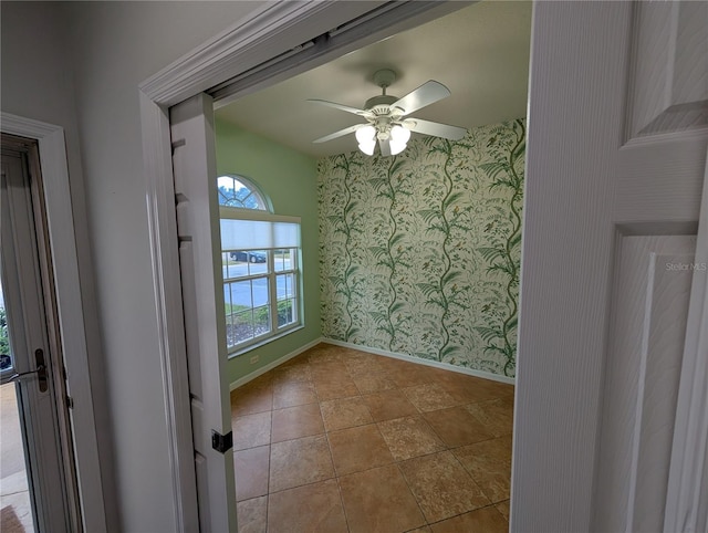 2641 73rd Ct W Unit 124, Bradenton, FL 34209 - empty room featuring wallpapered walls and a ceiling fan