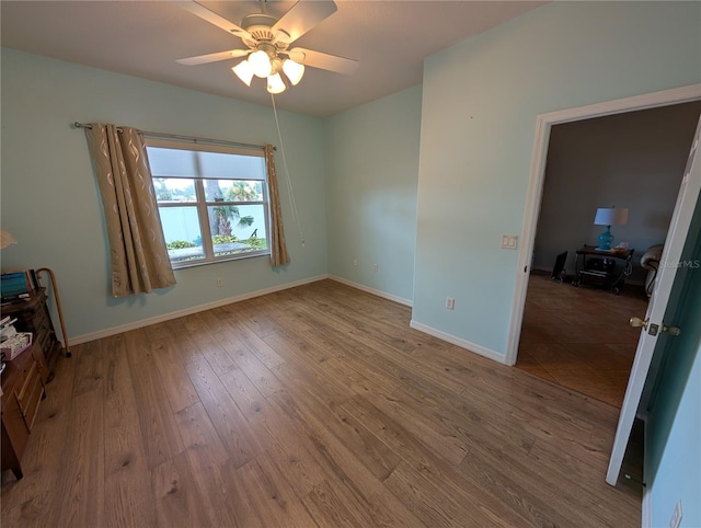 2641 73rd Ct W Unit 124, Bradenton, FL 34209 - empty room featuring a ceiling fan and wood finished floors