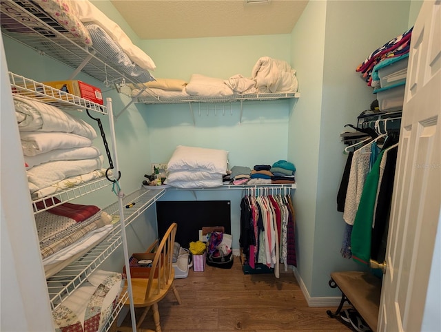 2641 73rd Ct W Unit 124, Bradenton, FL 34209 - walk in closet with wood finished floors