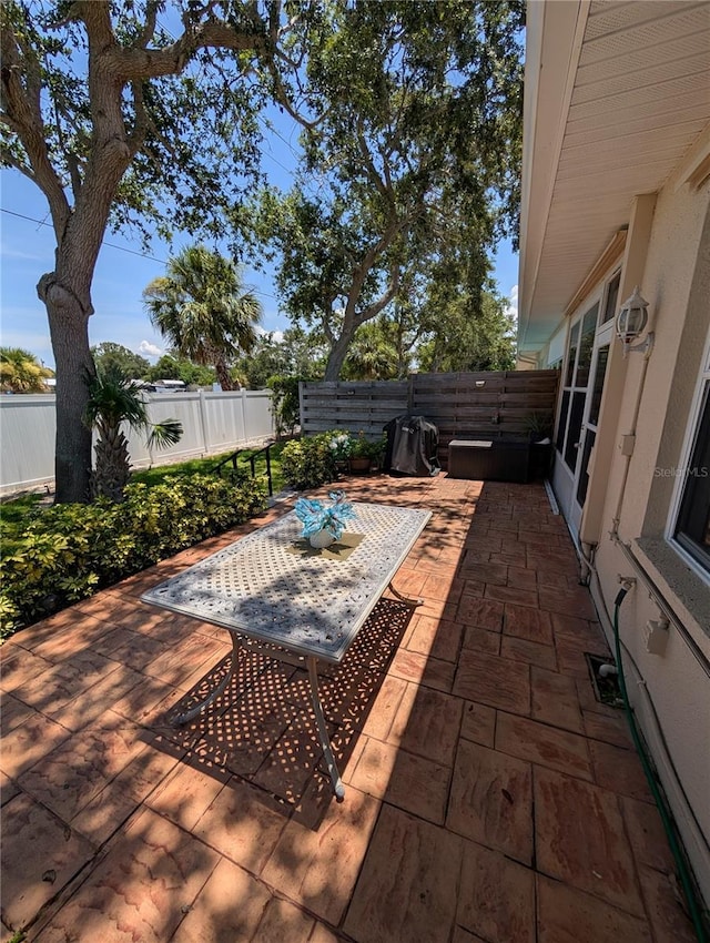 2641 73rd Ct W Unit 124, Bradenton, FL 34209 - fenced backyard featuring a patio area