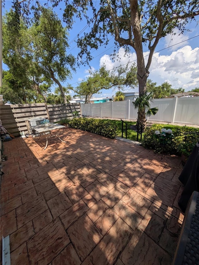 2641 73rd Ct W Unit 124, Bradenton, FL 34209 - deck with a fenced backyard and a patio