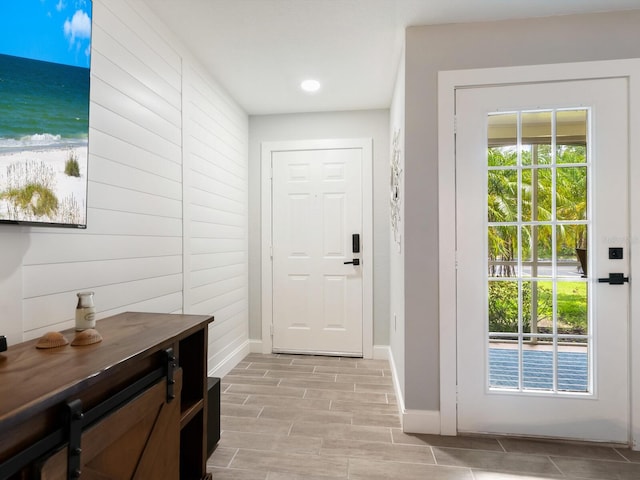 7424 Vista Way Unit 104, Bradenton, FL 34202 - doorway to outside featuring wood tiled floors and recessed lighting