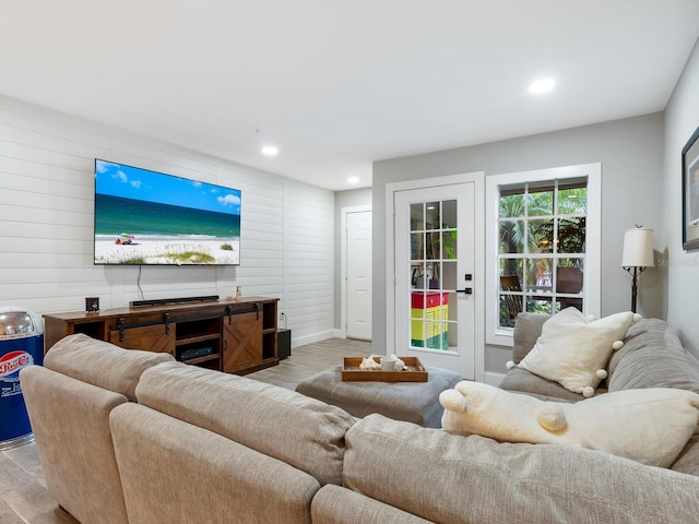 7424 Vista Way Unit 104, Bradenton, FL 34202 - living area featuring recessed lighting, light wood-style flooring, and wood walls
