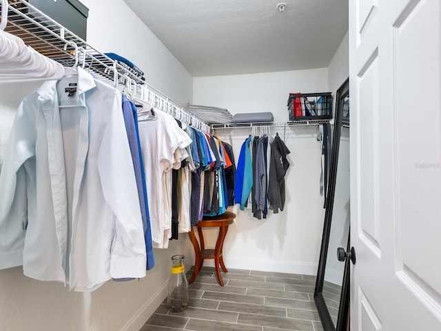7424 Vista Way Unit 104, Bradenton, FL 34202 - walk in closet featuring wood finished floors
