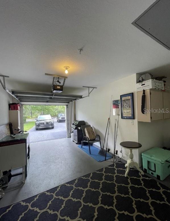 7424 Vista Way Unit 104, Bradenton, FL 34202 - garage featuring a garage door opener