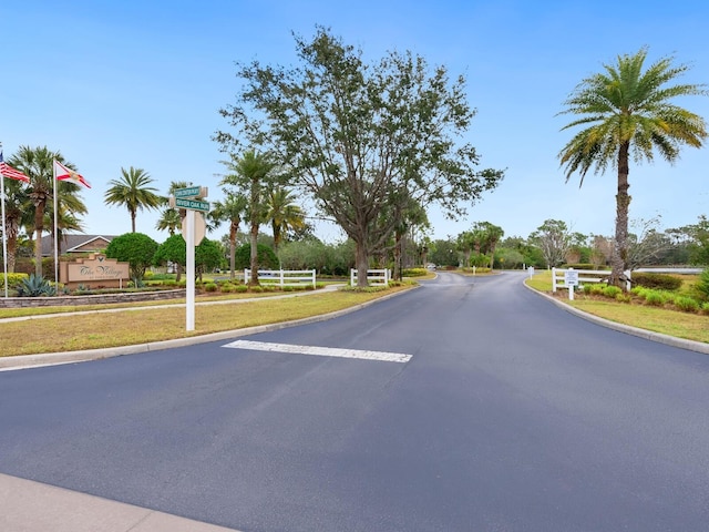 7424 Vista Way Unit 104, Bradenton, FL 34202 - view of asphalt street with curbs and traffic signs