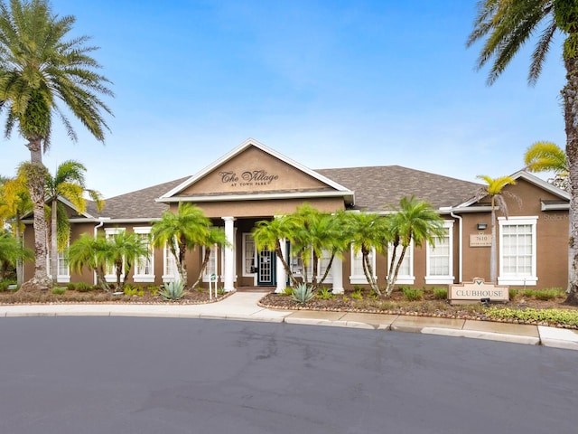 7424 Vista Way Unit 104, Bradenton, FL 34202 - view of front of home featuring a shingled roof and stucco siding