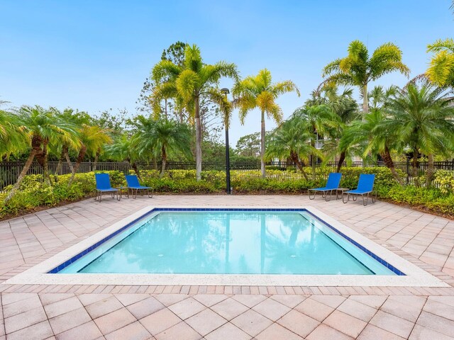 7424 Vista Way Unit 104, Bradenton, FL 34202 - view of swimming pool with a patio