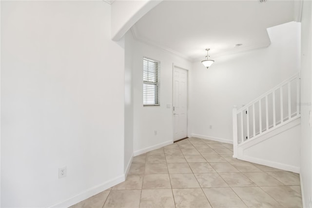 9629 Ivory Dr, Ruskin, FL 33573 - entrance foyer featuring ornamental molding, arched walkways, stairs, and light tile patterned flooring