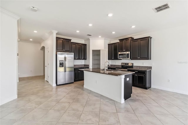 9629 Ivory Dr, Ruskin, FL 33573 - kitchen featuring stainless steel appliances, ornamental molding, an island with sink, light tile patterned flooring, and recessed lighting