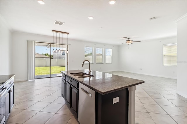9629 Ivory Dr, Ruskin, FL 33573 - kitchen with stainless steel dishwasher, light tile patterned floors, a ceiling fan, a kitchen island with sink, and hanging light fixtures