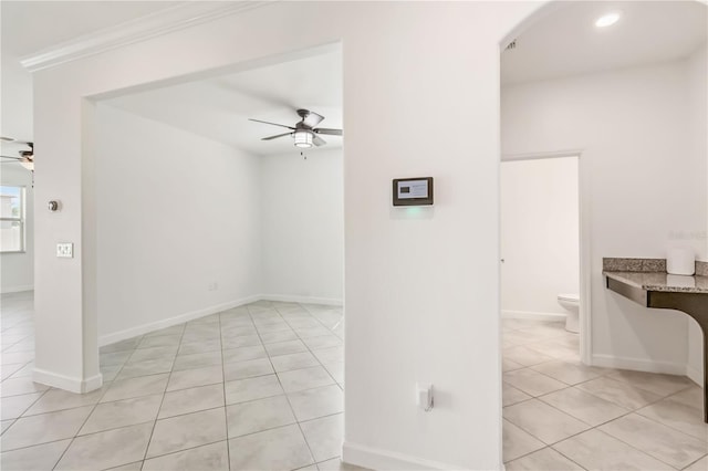 9629 Ivory Dr, Ruskin, FL 33573 - empty room featuring ceiling fan, light tile patterned floors, arched walkways, and recessed lighting