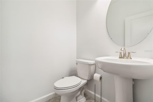 9629 Ivory Dr, Ruskin, FL 33573 - half bath with baseboards and toilet
