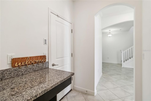9629 Ivory Dr, Ruskin, FL 33573 - hall with arched walkways and light tile patterned floors