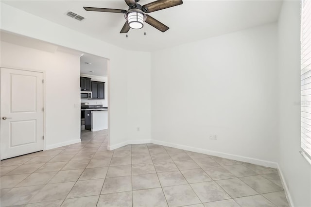 9629 Ivory Dr, Ruskin, FL 33573 - empty room featuring ceiling fan and light tile patterned flooring