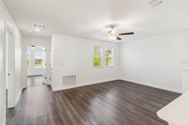 9629 Ivory Dr, Ruskin, FL 33573 - empty room with a ceiling fan and dark wood-style flooring