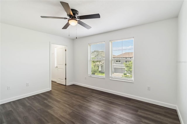 9629 Ivory Dr, Ruskin, FL 33573 - empty room featuring dark wood-style flooring and a ceiling fan