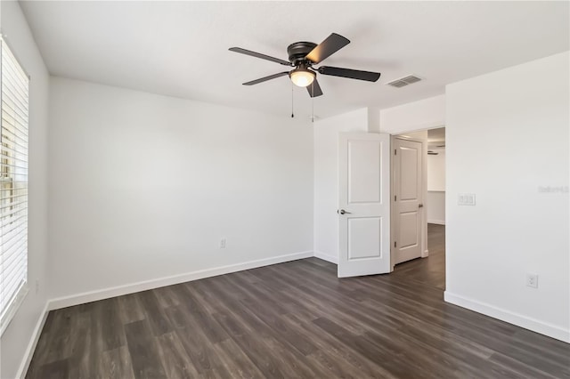 9629 Ivory Dr, Ruskin, FL 33573 - unfurnished bedroom with dark wood finished floors and ceiling fan