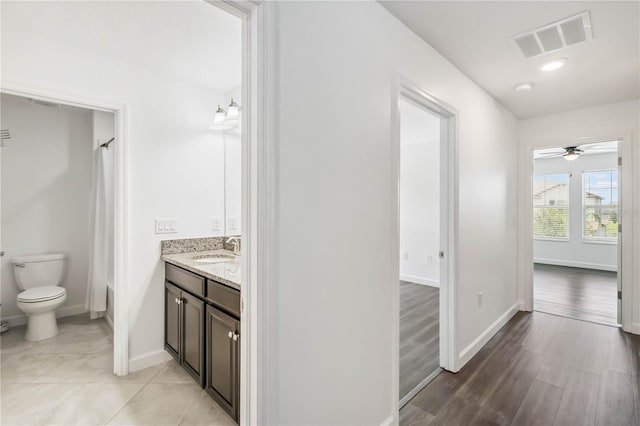 9629 Ivory Dr, Ruskin, FL 33573 - hallway with a sink and light wood-type flooring